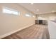 Bonus room featuring a wet bar, cabinets, and windows for natural light at 2442 S Bannock St, Denver, CO 80223