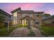 Modern townhomes boasting mixed brick and siding exteriors, complemented by professionally landscaped front yards and welcoming walkways at 2442 S Bannock St, Denver, CO 80223