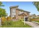 Modern townhomes boasting mixed brick and siding exteriors, complemented by professionally landscaped front yards and welcoming walkways at 2442 S Bannock St, Denver, CO 80223