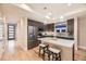 Modern kitchen with an island, stainless steel appliances, and wood flooring at 2442 S Bannock St, Denver, CO 80223