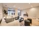Spacious living room featuring hardwood floors, neutral walls, and modern furnishings at 2442 S Bannock St, Denver, CO 80223