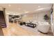 Open-concept living space featuring hardwood floors, neutral walls, and modern furnishings at 2442 S Bannock St, Denver, CO 80223