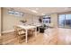 Open-concept living and dining space with hardwood floors and modern decor at 2442 S Bannock St, Denver, CO 80223