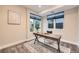 Bright office space with two windows, a modern desk, and neutral decor at 2442 S Bannock St, Denver, CO 80223