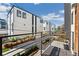 Balcony view of modern townhomes with black trim and railing, along with flower boxes at 3414 W 18Th Ave, Denver, CO 80204