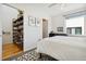 Bedroom with a bookshelf, neutral walls, a light gray carpet, and natural light at 3414 W 18Th Ave, Denver, CO 80204