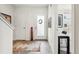 Bright entryway features tile flooring, a frosted-glass front door, and crisp white walls at 3414 W 18Th Ave, Denver, CO 80204
