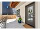 Charming townhouse entryway featuring a glass door, flower pot, and wooden accents at 3414 W 18Th Ave, Denver, CO 80204
