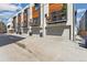 Modern townhome exteriors with sleek design, private balconies, and street parking at 3414 W 18Th Ave, Denver, CO 80204
