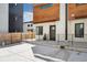 Modern townhome featuring wood accents, white walls, and black trim on the windows at 3414 W 18Th Ave, Denver, CO 80204
