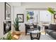 Comfortable living room featuring a fireplace, cozy seating, and large windows for natural light at 3414 W 18Th Ave, Denver, CO 80204