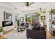Inviting living room features a modern fireplace, stylish furniture, and bright windows at 3414 W 18Th Ave, Denver, CO 80204