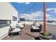 Inviting rooftop deck with comfortable seating and cityscape views, perfect for outdoor relaxation at 3414 W 18Th Ave, Denver, CO 80204