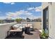 Inviting rooftop deck with comfortable seating, fire pit, string lights and serene outdoor ambiance at 3414 W 18Th Ave, Denver, CO 80204