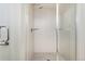 Bright walk-in shower with white tiling and glass doors, accented by modern hardware at 3414 W 18Th Ave, Denver, CO 80204
