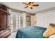 Relaxing bedroom with a cozy bed, access to outdoor space through French doors, and ample closet space at 3798 E 118Th Way, Thornton, CO 80233