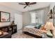 Bright bedroom with a cozy bed, large window with sheer curtains, and ample storage with a spacious closet at 3798 E 118Th Way, Thornton, CO 80233