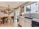 Eat-in kitchen with stylish dining table, modern lighting, and contemporary finishes for a cozy dining experience at 3798 E 118Th Way, Thornton, CO 80233