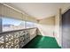 Spacious balcony with green carpeting and city views at 3184 S Heather Gardens Way # 403, Aurora, CO 80014