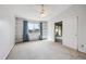 Bright bedroom with built-in shelves and balcony access at 3184 S Heather Gardens Way # 403, Aurora, CO 80014