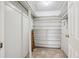 Large walk-in closet with shelving at 3184 S Heather Gardens Way # 403, Aurora, CO 80014
