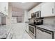 Stainless steel appliances and granite countertops at 3184 S Heather Gardens Way # 403, Aurora, CO 80014
