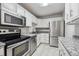 Bright kitchen with stainless steel appliances at 3184 S Heather Gardens Way # 403, Aurora, CO 80014