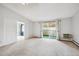 Spacious living room with access to balcony at 3184 S Heather Gardens Way # 403, Aurora, CO 80014