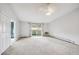 Living room with balcony access and carpet at 3184 S Heather Gardens Way # 403, Aurora, CO 80014