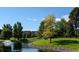Landscaped pond with fountain near residential buildings at 3184 S Heather Gardens Way # 403, Aurora, CO 80014