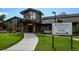 Restaurant entrance with a paved walkway and landscaping at 3184 S Heather Gardens Way # 403, Aurora, CO 80014