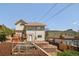 Back of house featuring a backyard with terraced landscaping and a hot tub at 420 Sunshine Pkwy, Golden, CO 80403
