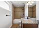 Bright bathroom with vanity, granite countertop, and tiled shower/tub combo at 420 Sunshine Pkwy, Golden, CO 80403