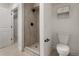Bright bathroom featuring walk-in shower, and modern toilet with storage cabinet at 420 Sunshine Pkwy, Golden, CO 80403