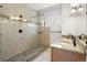 Luxurious bathroom with stone shower, dual sinks, and neutral granite countertops at 420 Sunshine Pkwy, Golden, CO 80403