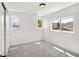 Well-lit bedroom featuring neutral carpet, white trim, double door closet, and multiple windows at 420 Sunshine Pkwy, Golden, CO 80403