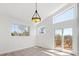 Bright bonus room with balcony access and large windows showing beautiful natural light at 420 Sunshine Pkwy, Golden, CO 80403
