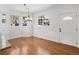 Bright dining room featuring hardwood floors, three windows and a chandelier at 420 Sunshine Pkwy, Golden, CO 80403