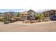 Two-story home with an attached garage, landscaping, and a paved driveway at 420 Sunshine Pkwy, Golden, CO 80403