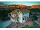 Inviting two-story home featuring a well-maintained lawn and mountain views at 420 Sunshine Pkwy, Golden, CO 80403