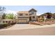 Two-story home with a two-car garage and a paved driveway at 420 Sunshine Pkwy, Golden, CO 80403