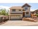 Charming two-story home with a two car garage, well-maintained lawn, and inviting curb appeal at 420 Sunshine Pkwy, Golden, CO 80403