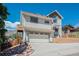 This home features an attached garage and beautiful rock features in the front yard at 420 Sunshine Pkwy, Golden, CO 80403
