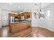 Bright kitchen with an island, wood cabinets, stainless steel appliances, and hardwood floors at 420 Sunshine Pkwy, Golden, CO 80403