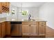 Kitchen featuring stainless steel dishwasher, granite countertop, hardwood floors and cabinets at 420 Sunshine Pkwy, Golden, CO 80403