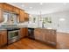 Kitchen featuring granite countertops, hardwood floors and cabinets plus stainless steel appliances at 420 Sunshine Pkwy, Golden, CO 80403