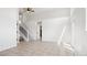 Bright living room with neutral tile floor, staircase, ceiling fan, and lots of natural light at 420 Sunshine Pkwy, Golden, CO 80403
