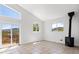 Light-filled living room featuring a wood-burning stove, sliding door and mountain views at 420 Sunshine Pkwy, Golden, CO 80403