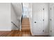 Well-lit stairwell with wooden stairs, black iron railings and hardwood floors at 420 Sunshine Pkwy, Golden, CO 80403