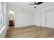 Bright bedroom with wood floors, a ceiling fan and ensuite bathroom at 9120 E Girard Ave # 12, Denver, CO 80231